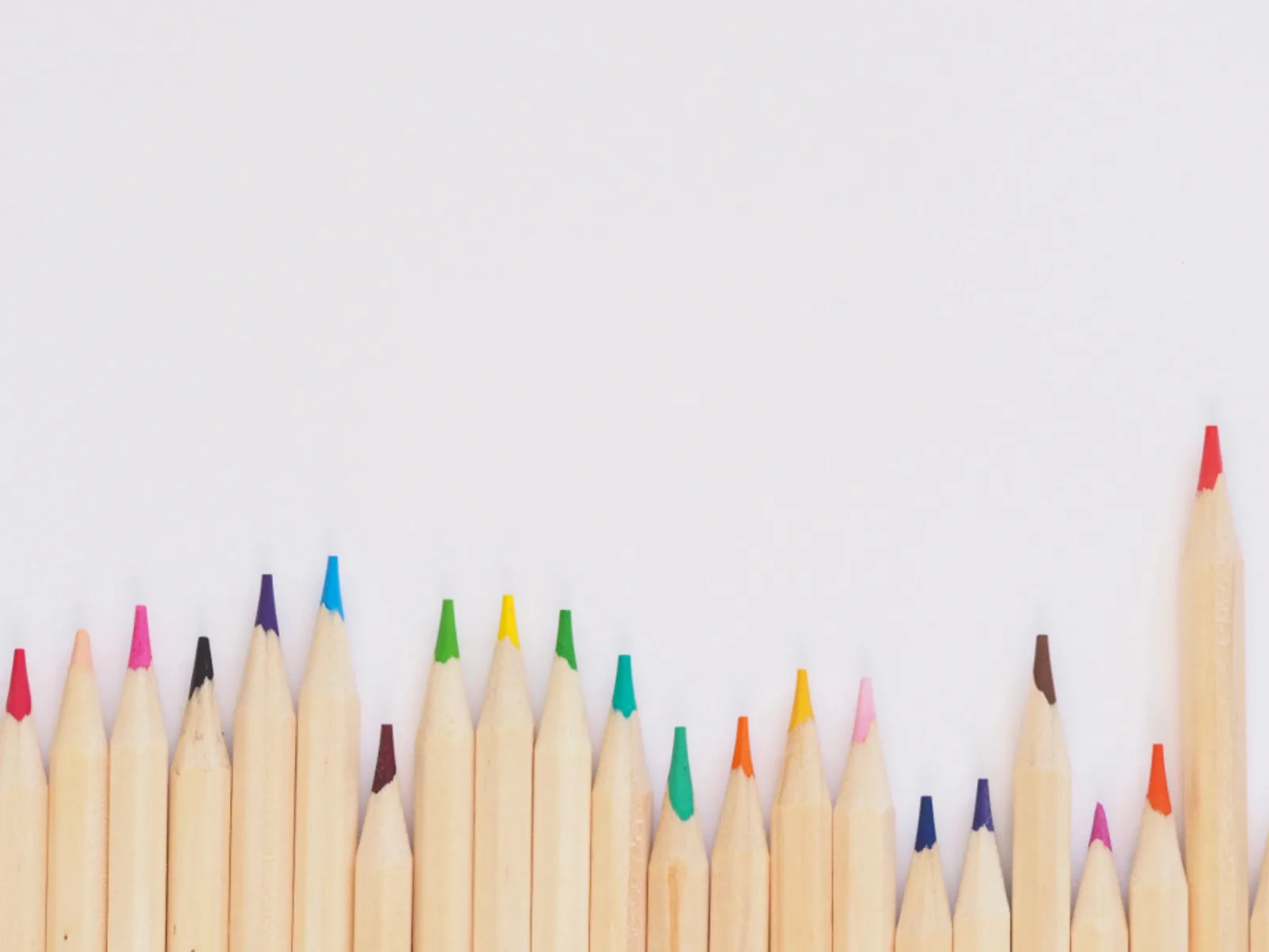 A row of sharpened colour pencils